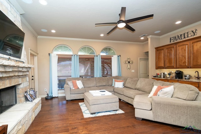 111 Winifreds Way, Hallsville, TX 75650 - living area with ceiling fan, ornamental molding, dark wood-type flooring, and a fireplace