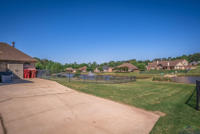 111 Winifreds Way, Hallsville, TX 75650 - view of yard with fence, a residential view, central AC, a water view, and a patio