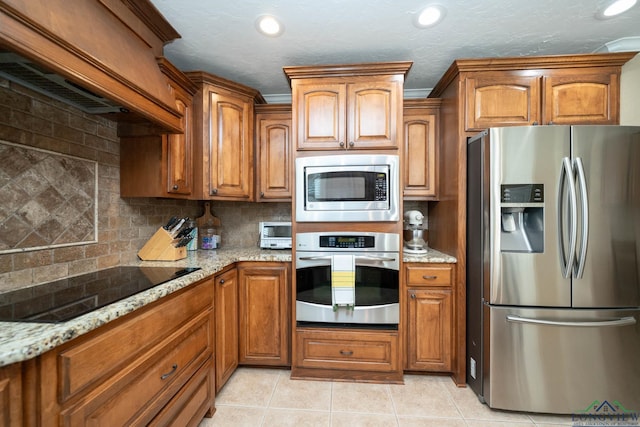 111 Winifreds Way, Hallsville, TX 75650 - kitchen with brown cabinetry and appliances with stainless steel finishes