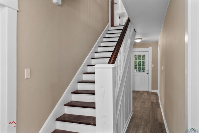 staircase featuring hardwood / wood-style flooring