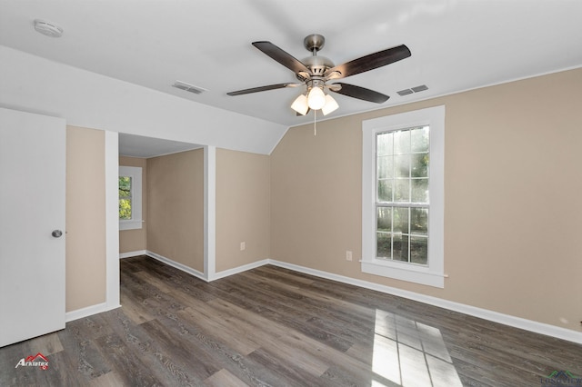 unfurnished room with ceiling fan, dark wood-type flooring, and vaulted ceiling