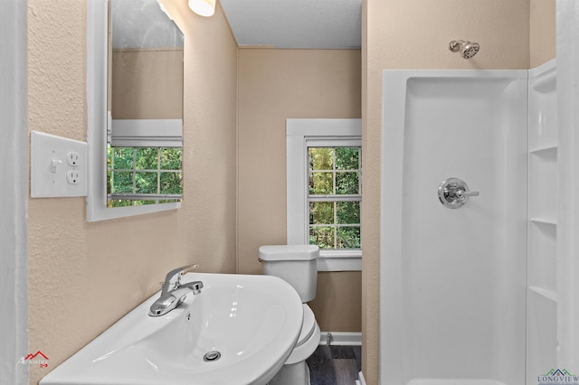 bathroom featuring sink and walk in shower