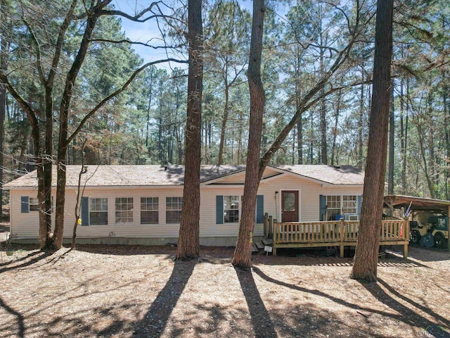 back of house featuring a wooden deck