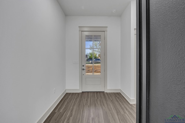 1509 Wellington Ln, Longview, TX 75605 - doorway featuring wood finished floors and baseboards