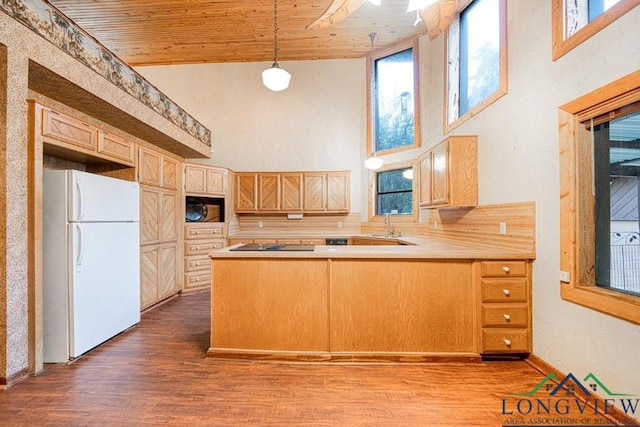 kitchen with black appliances, wood ceiling, and a high ceiling