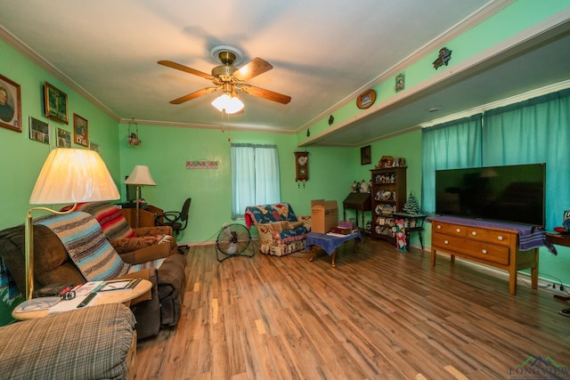 game room featuring ceiling fan, wood finished floors, and ornamental molding