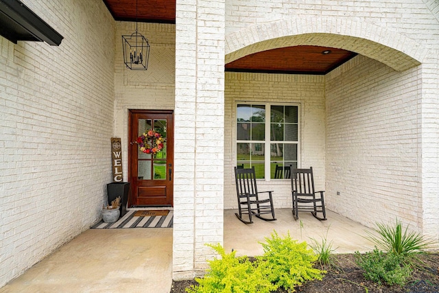 property entrance featuring covered porch