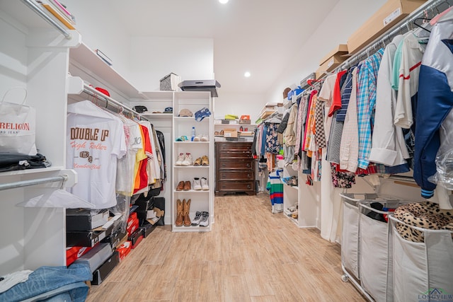 spacious closet with light hardwood / wood-style flooring