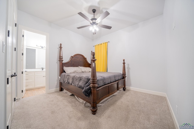 carpeted bedroom featuring connected bathroom and ceiling fan