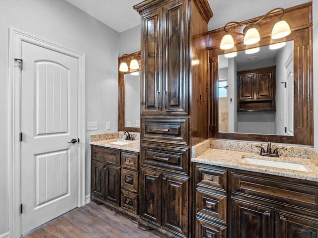 bathroom featuring vanity and hardwood / wood-style flooring