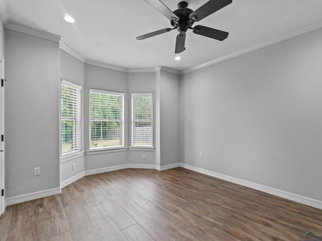 unfurnished room featuring ceiling fan, dark hardwood / wood-style flooring, and ornamental molding