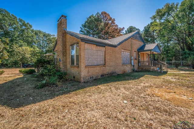 view of property exterior featuring a lawn