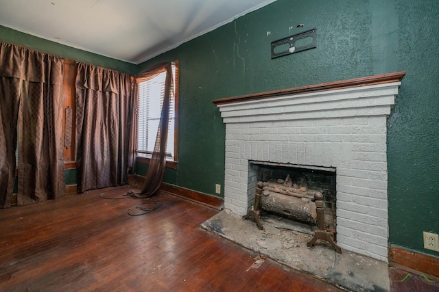 unfurnished living room with a fireplace and dark hardwood / wood-style flooring