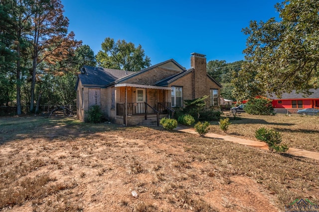 view of front of home with a front yard