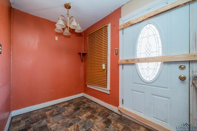 entrance foyer with an inviting chandelier