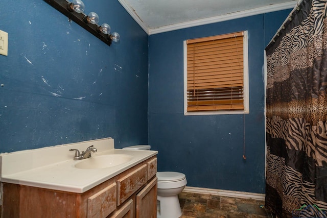 bathroom featuring vanity, toilet, and crown molding