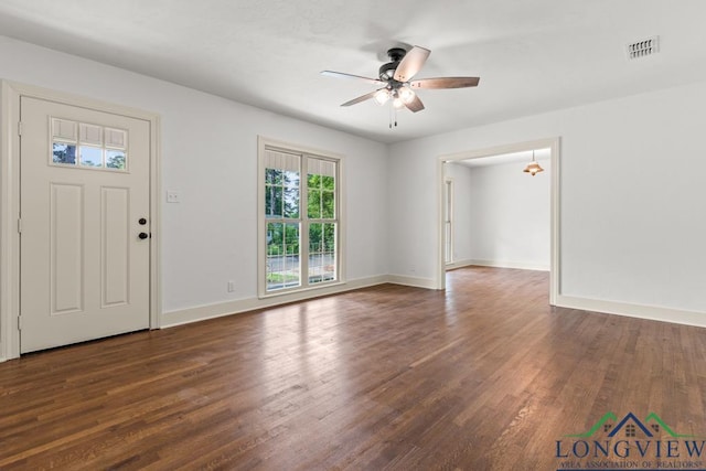 entryway featuring baseboards, ceiling fan, dark wood finished floors, and visible vents