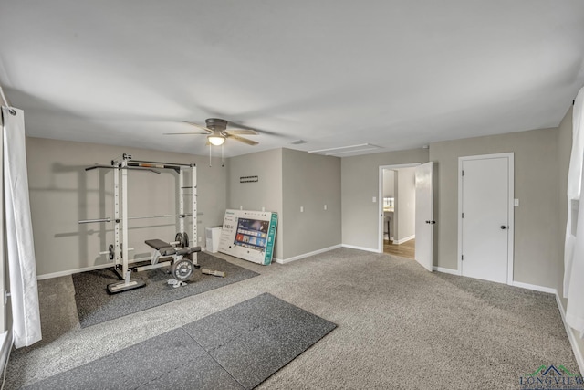 exercise area with ceiling fan and carpet