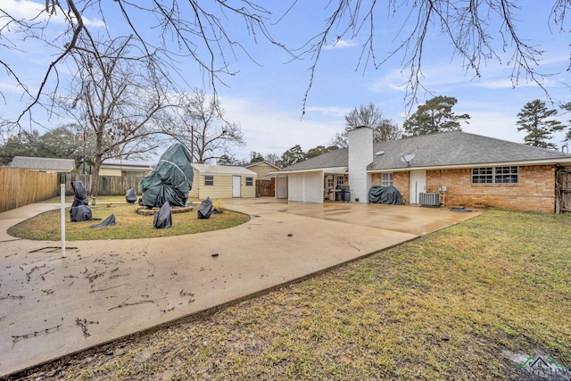 exterior space with a yard and central air condition unit