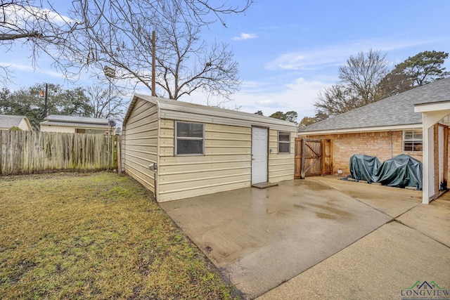 view of outbuilding with a yard