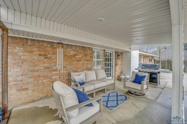 view of patio with grilling area and an outdoor living space