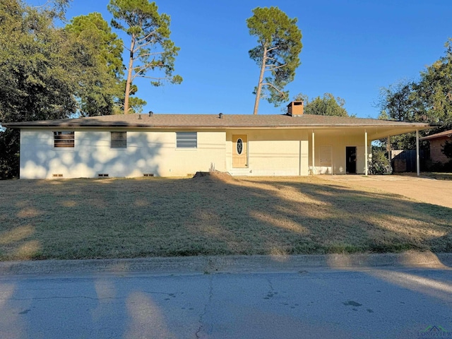 single story home with a carport and a front lawn