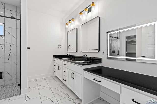 full bathroom featuring double vanity, baseboards, a shower stall, and marble finish floor
