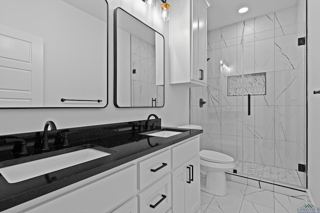 full bath with toilet, a marble finish shower, a sink, and marble finish floor