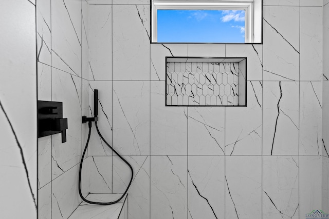 interior space featuring tiled shower