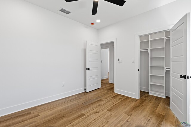 unfurnished bedroom featuring ceiling fan, light wood finished floors, recessed lighting, baseboards, and visible vents