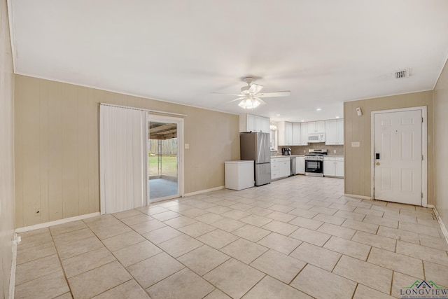 unfurnished living room featuring ceiling fan and light tile patterned flooring