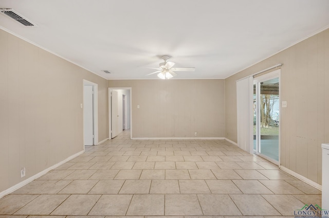 unfurnished room with ceiling fan and light tile patterned flooring