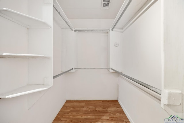 walk in closet featuring wood-type flooring