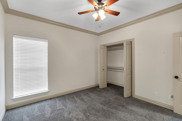 unfurnished bedroom featuring carpet floors, ornamental molding, multiple windows, and baseboards