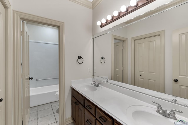 bathroom with double vanity, a sink, and tile patterned floors