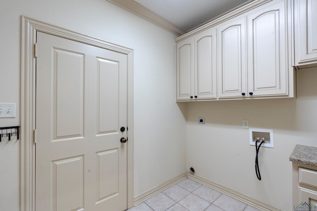 clothes washing area with crown molding, light tile patterned floors, hookup for a washing machine, cabinet space, and hookup for an electric dryer