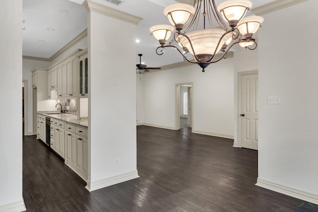 kitchen featuring ceiling fan with notable chandelier, a sink, black dishwasher, dark wood finished floors, and crown molding