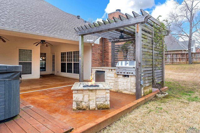 deck with an outdoor fire pit, fence, a pergola, and area for grilling