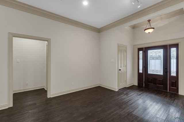 foyer entrance featuring dark wood-style floors, ornamental molding, and baseboards