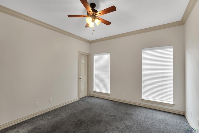 carpeted empty room featuring crown molding, baseboards, and ceiling fan