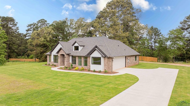 264 Clara Ln, Kilgore, TX 75662 - craftsman-style house with an attached garage, fence, concrete driveway, a front lawn, and brick siding