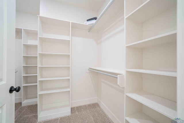 264 Clara Ln, Kilgore, TX 75662 - spacious closet featuring carpet flooring