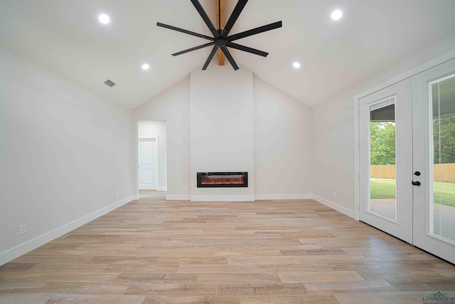264 Clara Ln, Kilgore, TX 75662 - unfurnished living room featuring a glass covered fireplace, a ceiling fan, visible vents, and french doors