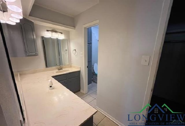 bathroom with tile patterned floors and vanity