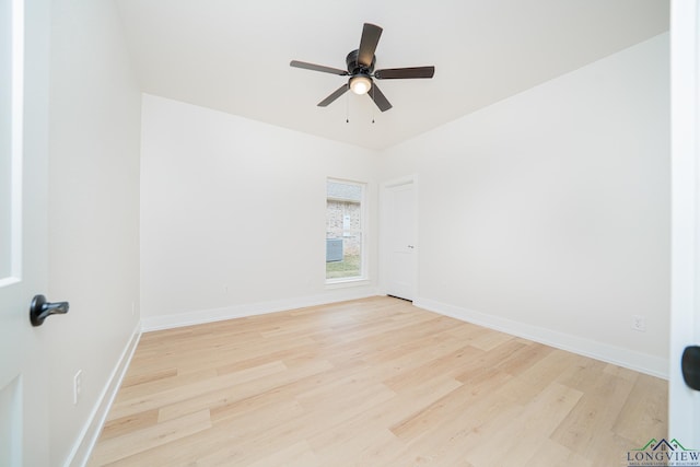 unfurnished room featuring ceiling fan and light wood-type flooring