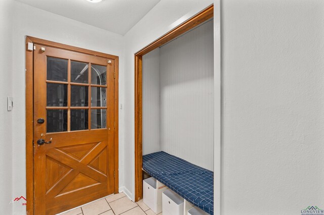 doorway to outside featuring light tile patterned floors