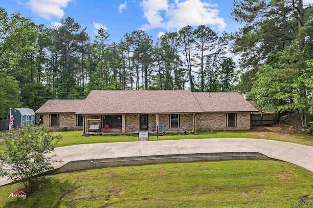 ranch-style home with a front yard