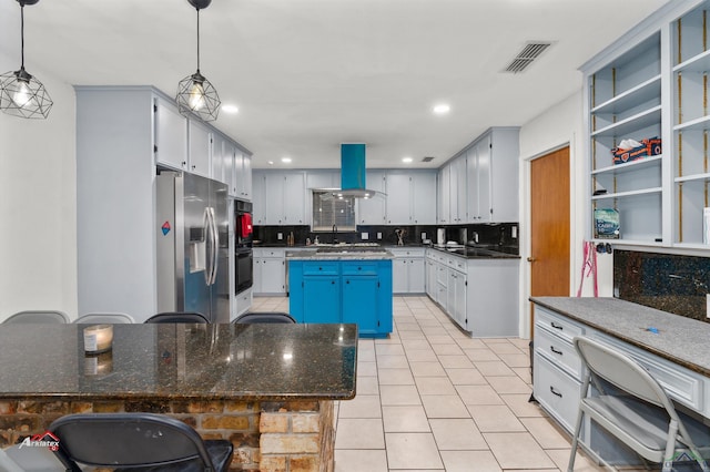 kitchen with stainless steel fridge, pendant lighting, decorative backsplash, a kitchen island, and island range hood