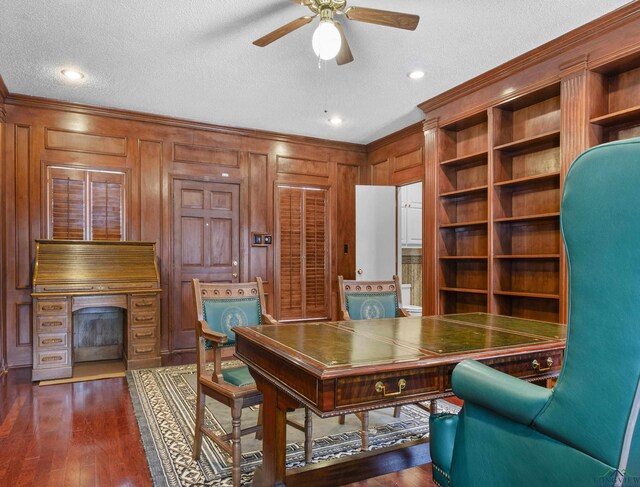 5908 Regents Row, Tyler, TX 75703 - office area featuring a ceiling fan, a textured ceiling, crown molding, a fireplace, and wood walls