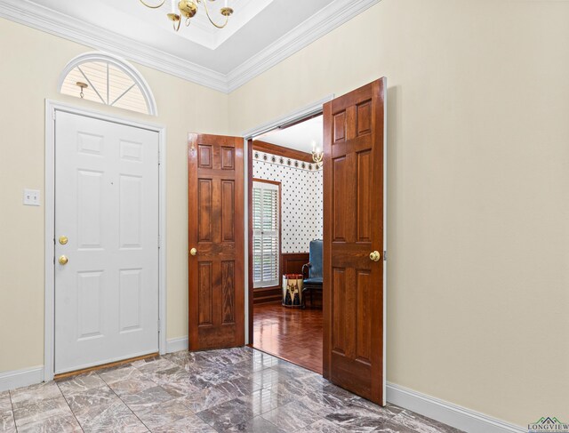 5908 Regents Row, Tyler, TX 75703 - entryway featuring a chandelier, crown molding, marble finish flooring, and baseboards